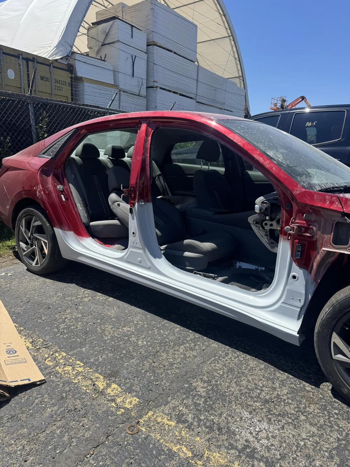 Hyundai sedan with rocker and pillar in primer before color